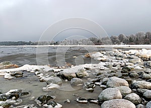 different ice formations on rocks on the seashore, ice texture, wind, water and ice working together