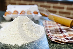 Different ingredients for preparing flour products on kitchen