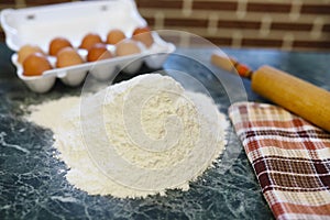 Different ingredients for preparing flour products on kitchen