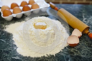 Different ingredients for preparing flour products on kitchen