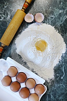 Different ingredients for preparing flour products on kitchen