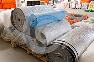 Different Insulation material in rolls for sale on a store warehouse