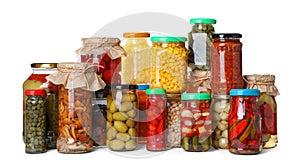 Different jars with pickled vegetables on white