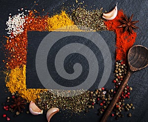 Different kind of spices on a black background