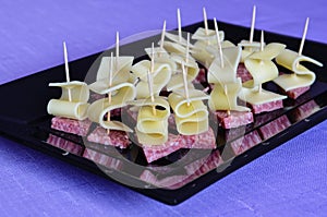 Different kinds of ham and cheese gauda arranged ready to be served for a party