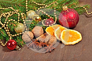 Different kinds of spices, nuts and dried oranges, Christmas dec