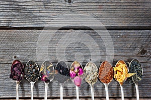 The different kinds of tea presented as a sample in the silver spoons, top view