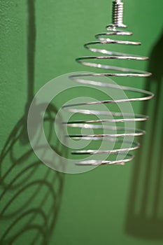 Different kitchen tools for cooking hanging on the wall.