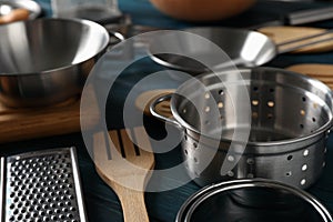 Different kitchen utensil on blue wooden background