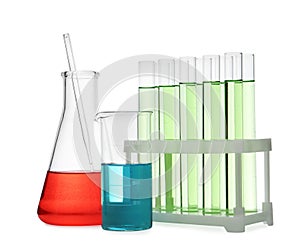 Different laboratory glassware with color liquid isolated on white