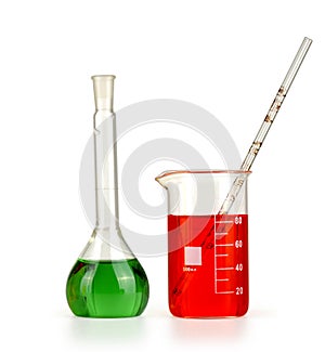 Different laboratory glassware with colored liquid isolated