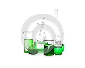 Different laboratory glassware with green liquid isolated on white