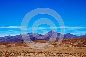 Different layers of Death Valley National Park with colorful mountains and sand dunes, USA