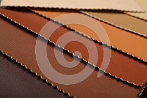 Different leather samples as background, closeup