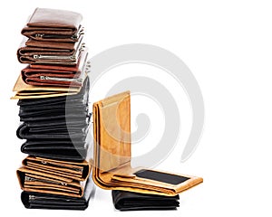 Stack of different wallets on white background