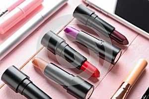 Different lipsticks on color table