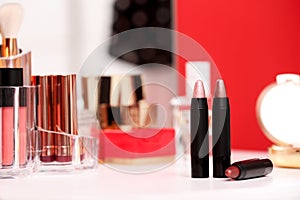 Different lipsticks on dressing table
