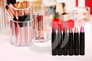 Different lipsticks on dressing table