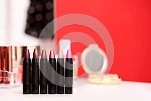 Different lipsticks on dressing table
