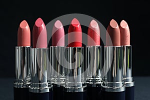 Different lipsticks on table photo
