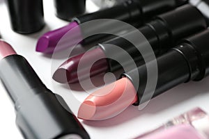 Different lipsticks on table, closeup