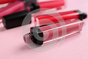 Different liquid lipsticks on table