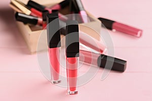 Different liquid lipsticks on table
