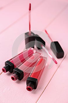 Different liquid lipsticks on table