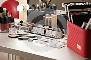 Different makeup products and accessories on dressing table