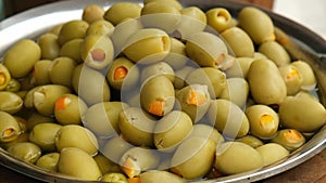 Different marinated olives and local food on street market in Gdansk, Poland. Selling and buying street food. Assortment