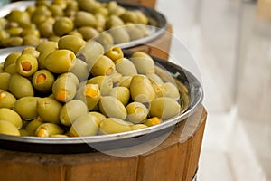 Different marinated olives and local food on street market in Gdansk, Poland. Selling and buying street food. Assortment