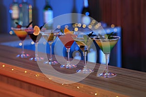 Different martini cocktails on table