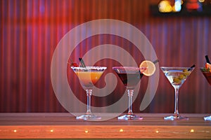 Different martini cocktails on table in bar