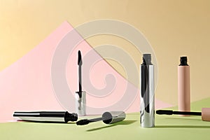 Different mascaras for eyelashes on color background