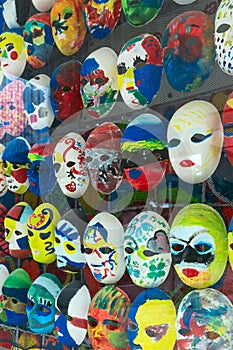 Different masks behind glass display cases
