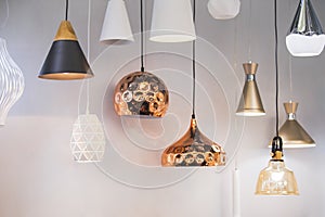 Different modern streamlined mirror copper chandeliers. Bubble metal copper shade pendant
