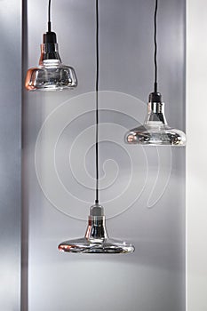 Different modern streamlined mirror silver chandeliers. Bubble metal shade pendant