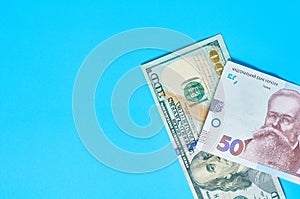 Different money on blue background. Payment of pensions, salaries. Bank loan photo