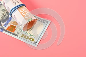 Different money on pink background. Payment of pensions, salaries