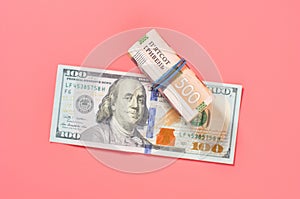 Different money on pink background. Payment of pensions, salaries