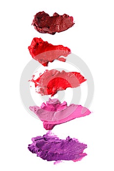 Different multi colored samples of a smudged lipstick