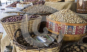 Different nuts in large wicker baskets at the bazaar in Turkey