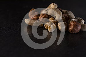 different nuts on a slate plate