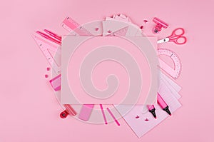 Different office supply and blank paper letterhead for text on pink color background, top view, copy space.