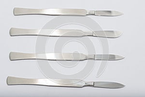 Different One-Piece Scalpels on white background