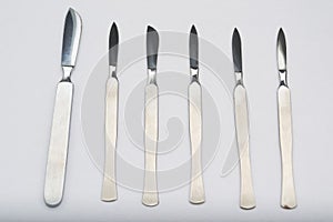 Different One-Piece Scalpels on white background