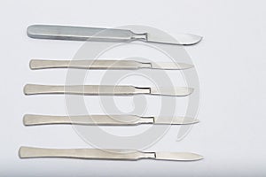 Different One-Piece Scalpels on white background