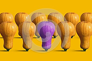 Different from other concepts. Purple Pumpkin as a light bulb symbolizes the idea. Creative poster for design. Stand out from the