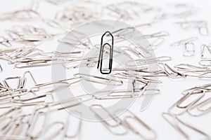 Different paperclips on white