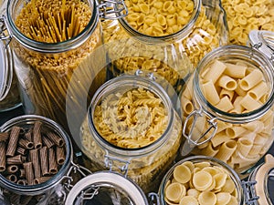 Different pasta in large glass jars